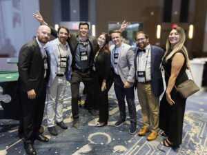 7 FLAGGL 2025 conference attendees posing for a photo