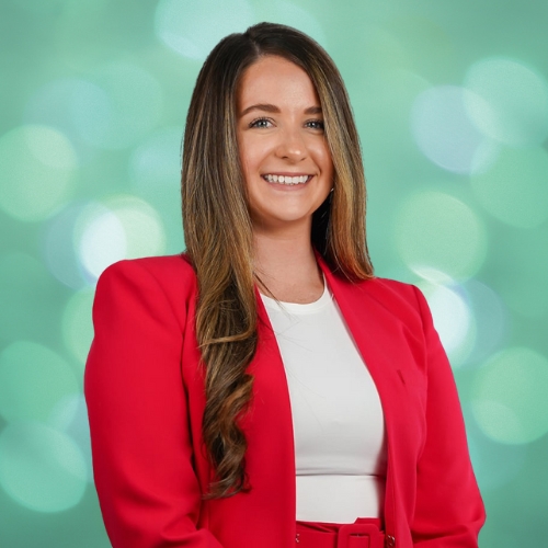 Katie Martinez, FLAGGL board member, in red blazer